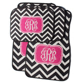 black and pink car mats with initials