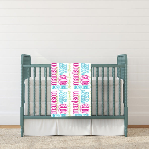 monogram baby blanket pink aqua hanging over baby crib