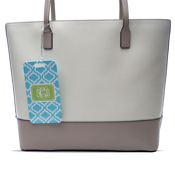 handbag with luggage tag attached