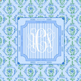 square monogram mahjong mat with floral pattern and monogram on a blue background